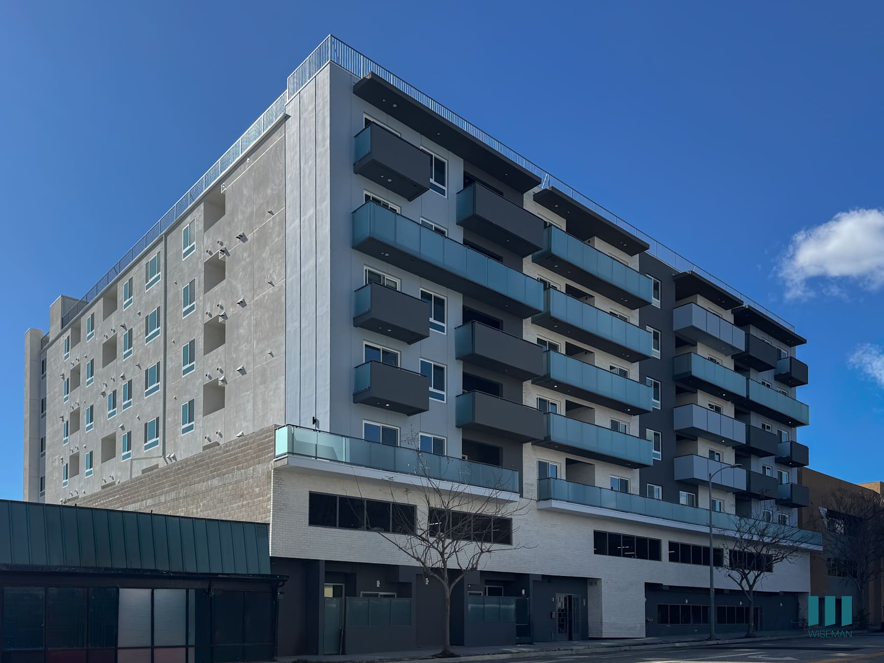 Motor Tides exterior with balconies and planted street frontage