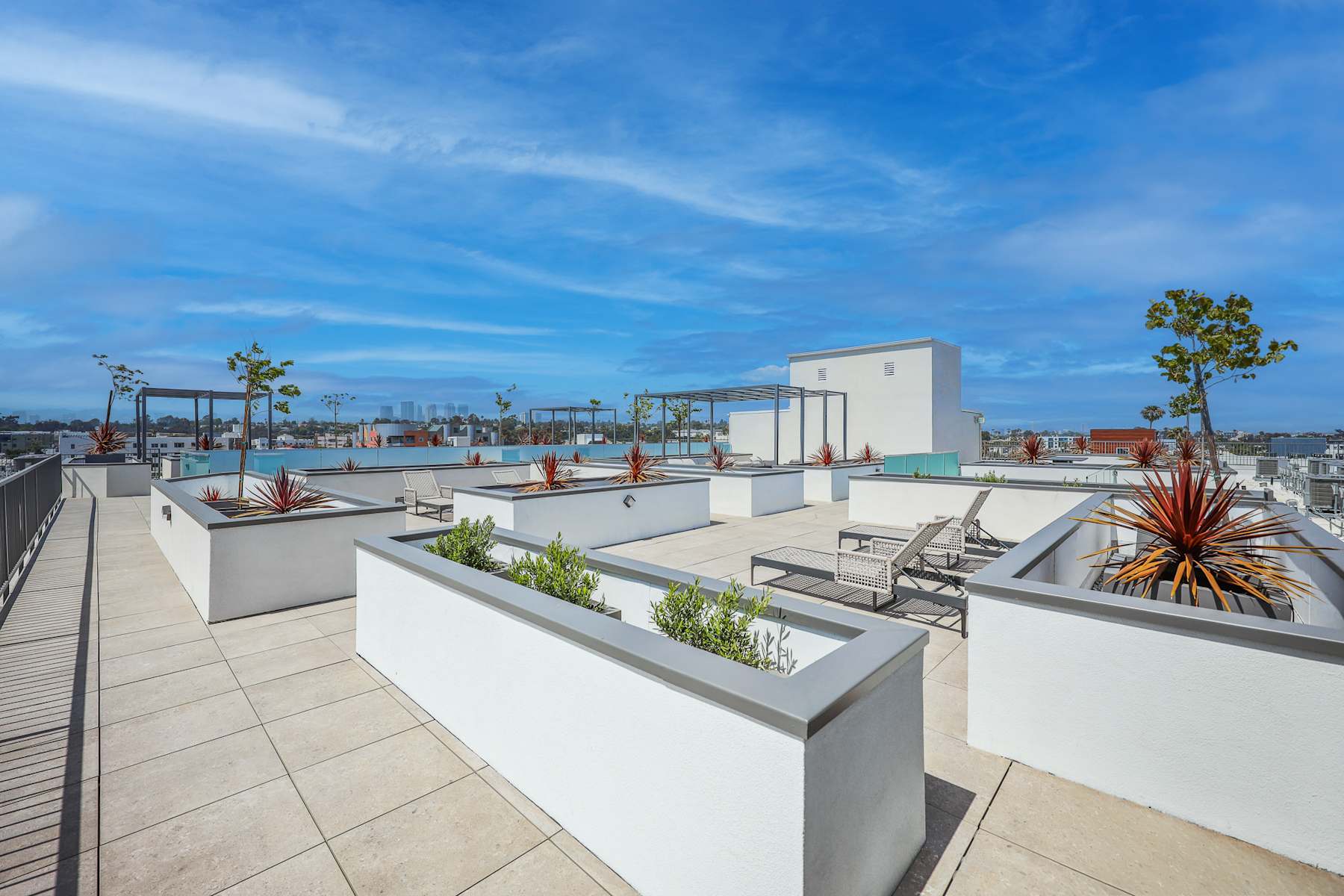 Rooftop deck with pergola seating and city views