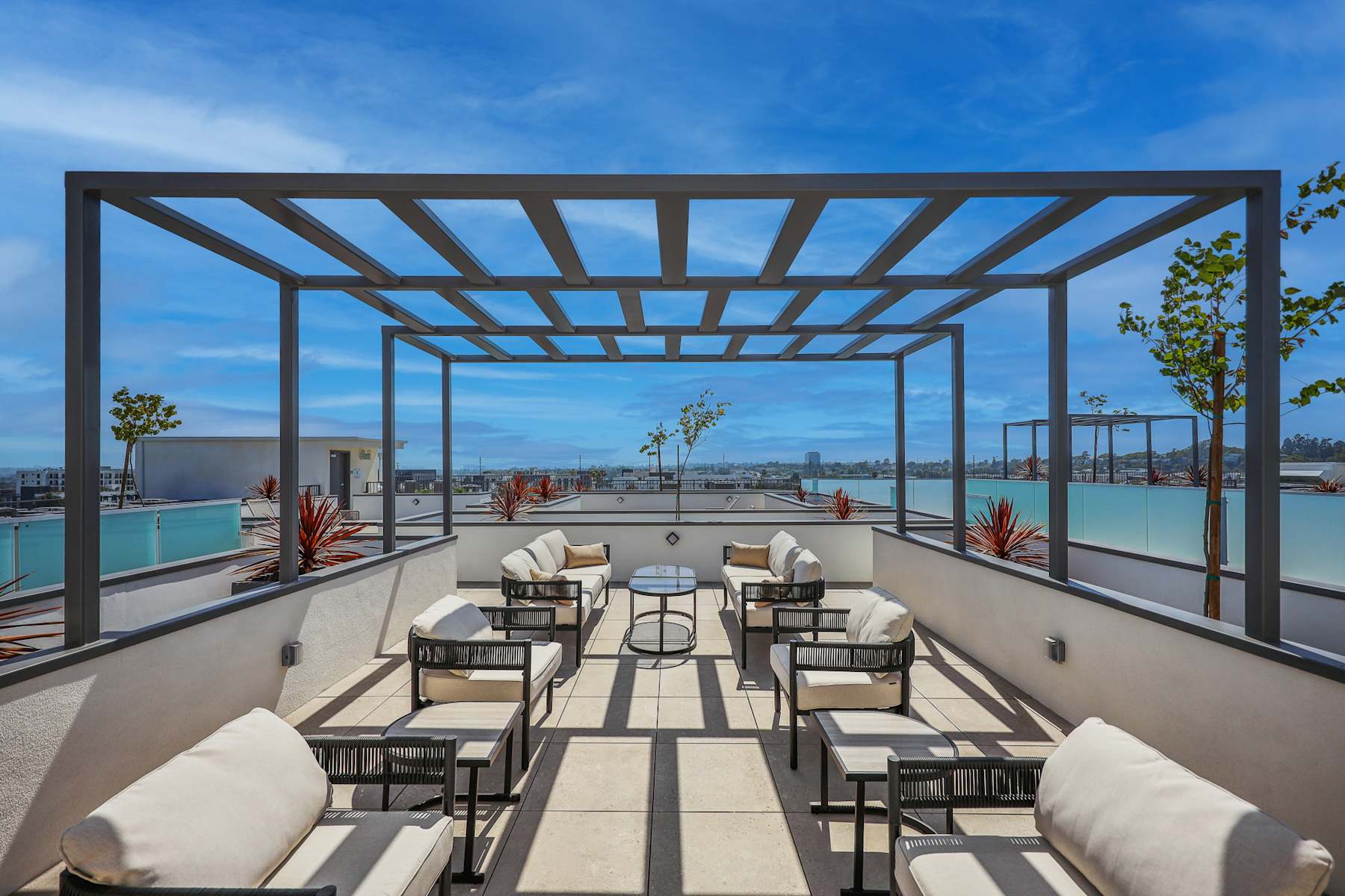 Rooftop lounge seating with sweeping city views